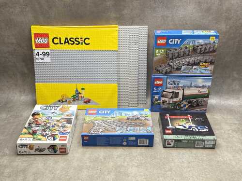 Three LEGO City sets and base plates