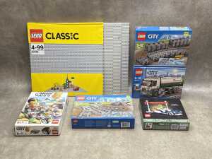 Three LEGO City sets and base plates