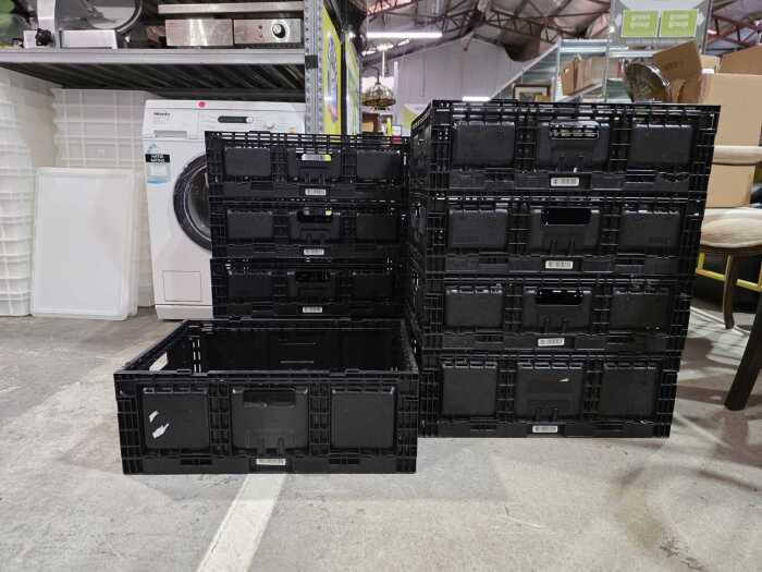 Nine black collapsible storage baskets