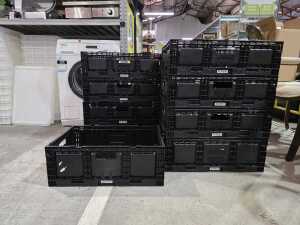 Nine black collapsible storage baskets
