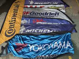 Nine nylon advertising feather banners for tyres