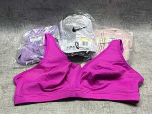 Three Aislin sports bras & Nike cap