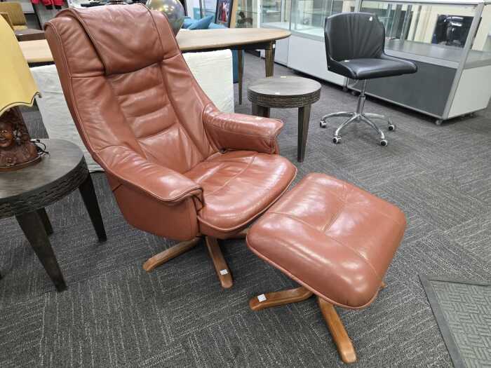 Artifex brown leather reclining armchair with footstool