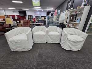 Set of four white barrel-back armchairs