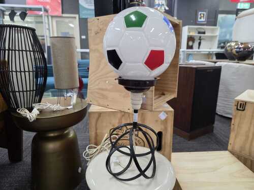 Soccer ball desk lamp with metal base.