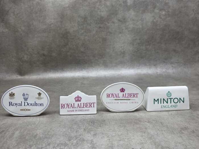 Four porcelain English porcelain dealer plaques