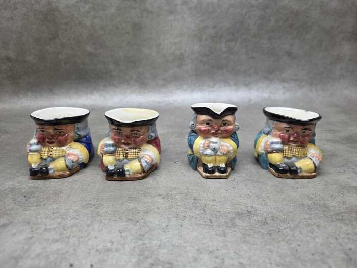 Four Clarice Cliff ceramic toby jugs