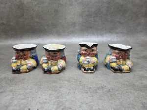 Four Clarice Cliff ceramic toby jugs