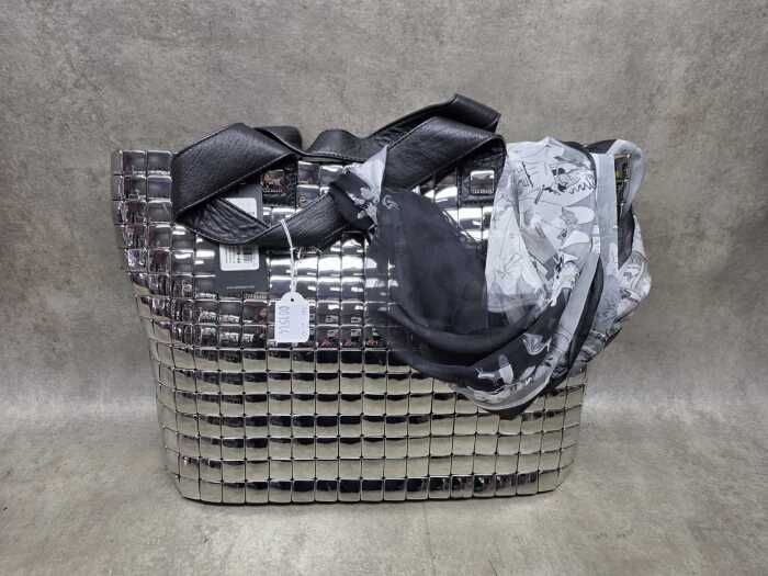Silver tone handbag with floral lining
