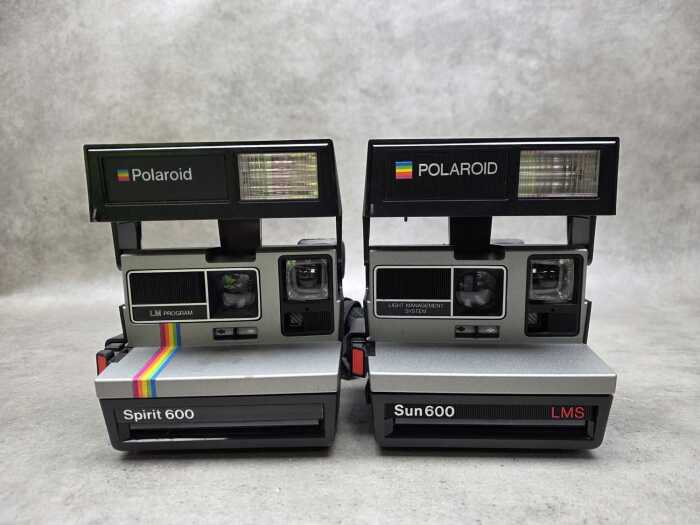 Two Polaroid instant cameras