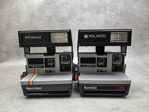 Two Polaroid instant cameras