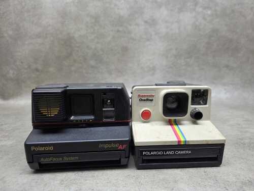 Two Polaroid instant cameras