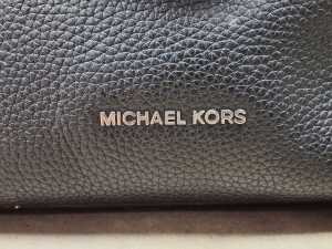 Black handbag with silver-tone hardware and a bag scarf - 4