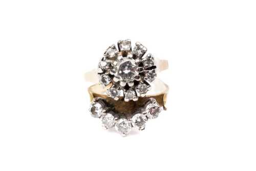 A broken-soldered two-diamond ring set in 18 carat and platinum