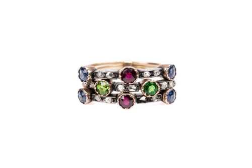 An antique three ring set in 9 carat yellow gold