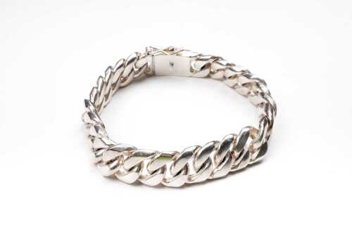 A large curb link bracelet in sterling silver