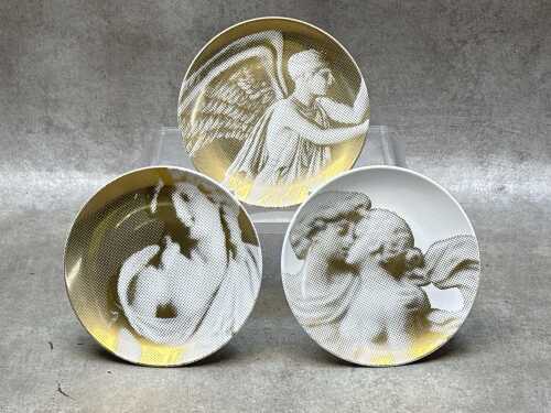 Three Wedgwood 'Gilded Muse' porcelain plates