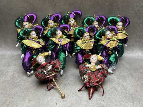 Porcelain jester and harlequin dolls.