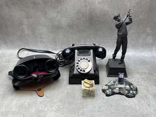 Collectible desk items, including a bakelite rotary black telephone