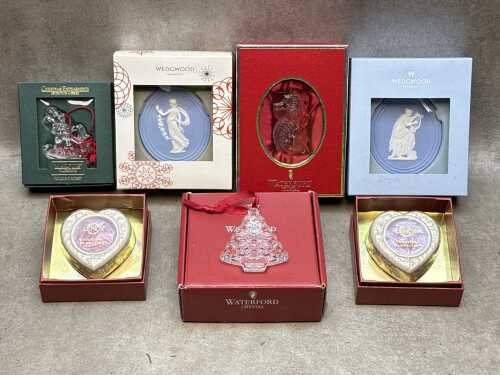 Seven Christmas-themed porcelain and crystal items, including Waterford