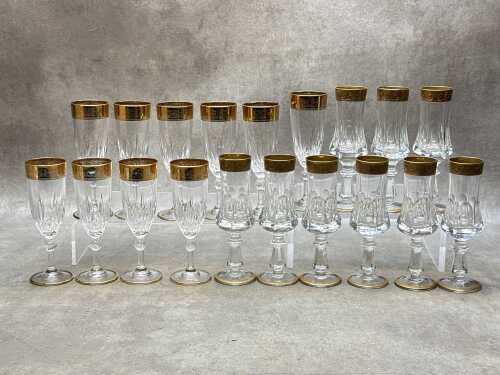 Two sets of crystal champagne flutes with gilded decoration