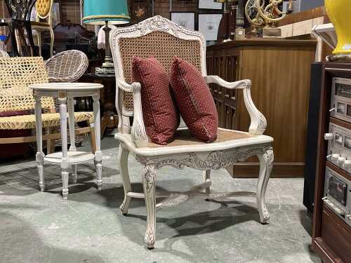 French Provincial-style painted cane armchair