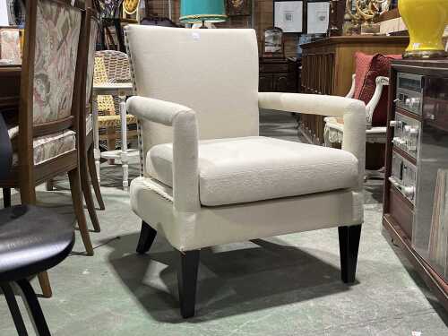 Cream upholstered armchair