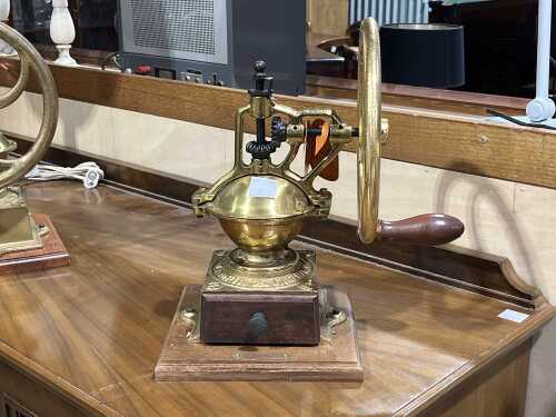 La Cimbali 'Ampia Garanzia' brass-finished coffee grinder on timber base