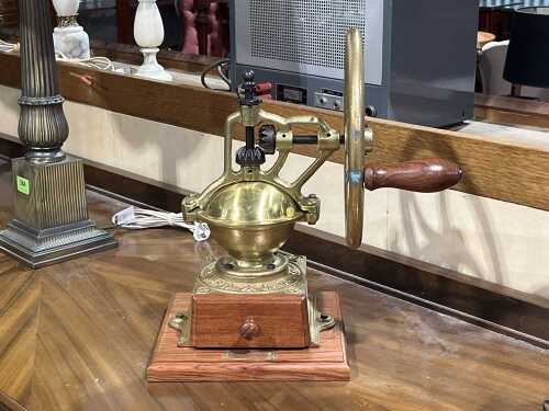 La Cimbali 'Ampia Garanzia' brass-finished coffee grinder on timber base