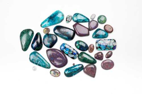 A collection of chrysocolla, imitation opal, triplets and mosaic opal.