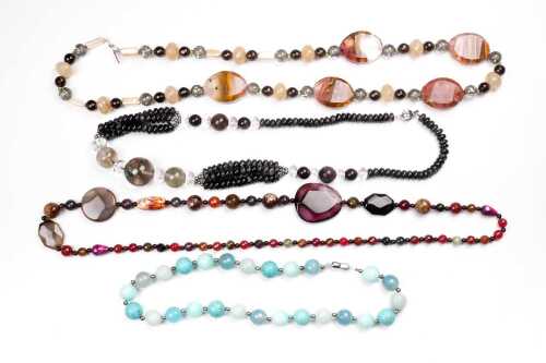 A collection of four gemstone necklaces
