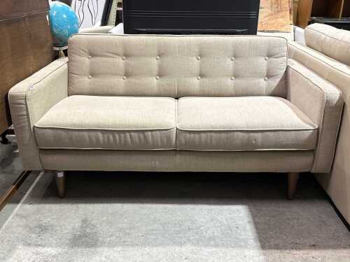 Contemporary beige upholstered two-seat sofa