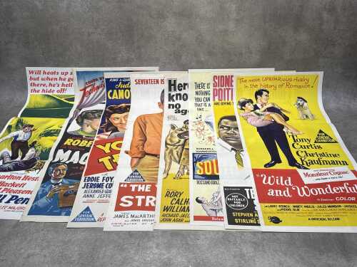Eight movie posters, including South Pacific