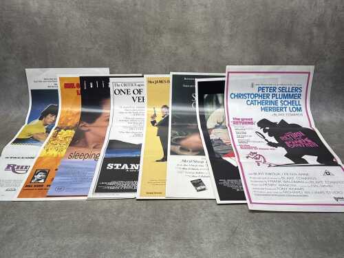 Eight movie posters, including Stand By Me