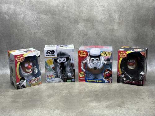 Four Mr Potatohead figures in original boxes