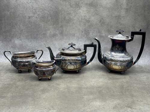 Silver-plated four piece tea service with floral design and ball feet