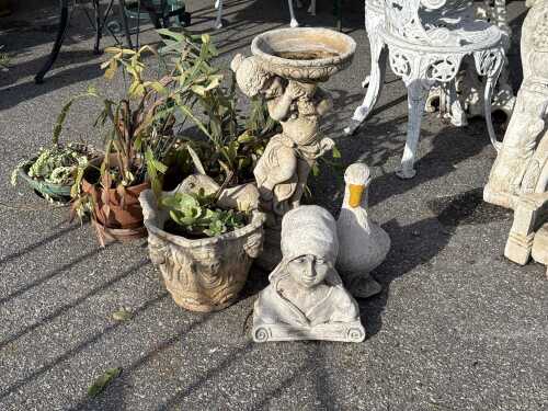 Four assorted garden ornaments and planters
