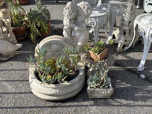 Four assorted garden statues and planters