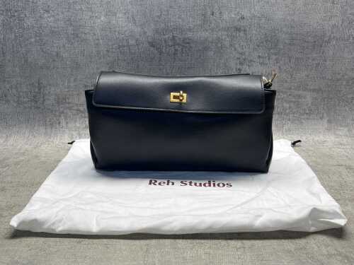 92 · Designer-style black leather handbag with gold-tone hardware.