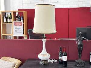 Milk glass lamp with gold-tone floral and leaf scroll accents.