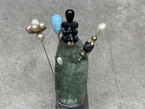 Two cast metal shoes, including a pin cushion with hat pins - 3