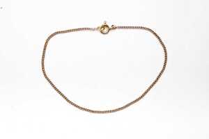 A curb link bracelet in 18 carat yellow gold
