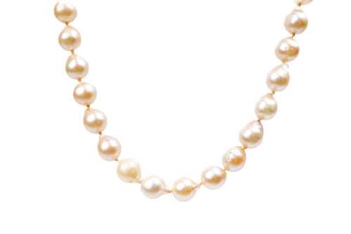 A strand of semi baroque pearls to a silver clasp