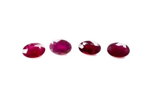 A collection of four natural oval rubies