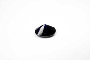 An oval synthetic blue sapphire - 3