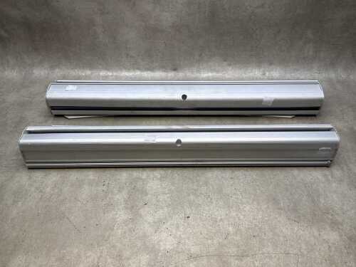 Two Pirelli pull up vinyl banners in aluminium rollers