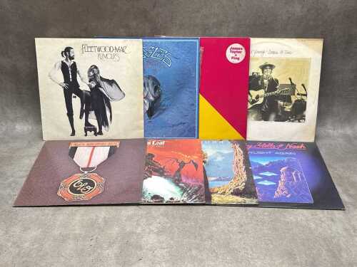 Eight vinyl records, including Fleetwood Mac, Meatloaf, Eagles