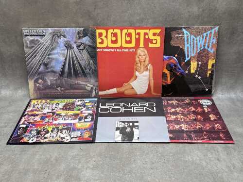 Six vinyl records, including Steely Dan, David Bowie