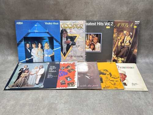 Nine vinyl records, mostly Rock and Pop, including ABBA