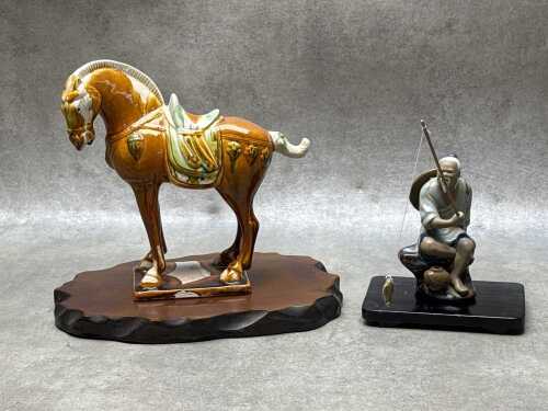 Two Chinese ceramic figures on timber stands